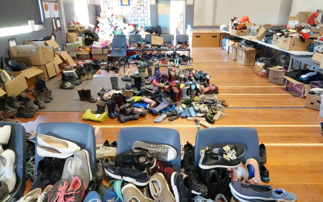Puketapu School hall is full of donated food and clothes for people in need to pick up.