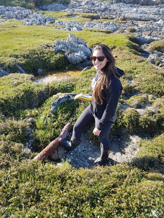 Kristie-Lee collecting physical evidence for past tsunami – fish factory pipes that were damaged in 1924.