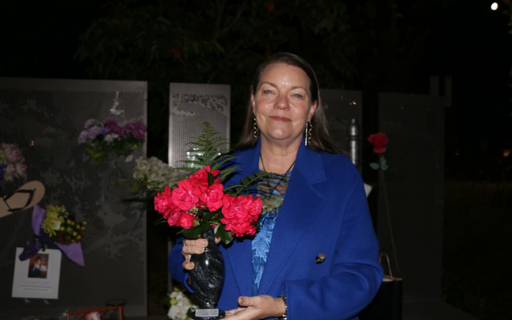 Kim Annan with the roses taken from the plant that grew on the CTV site post-quake. She brings some back every year on the anniversary in a vase with Stephen’s name inscribed on the bottom.