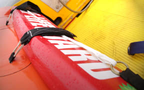 A Surf Life Saving rescue boat on Muriwai Beach, Auckland.