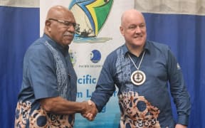 Fijian PM Sitiveni Rabuka greets NZ PM Christopher Luxon at the Pacific Islands Forum in Honiara.