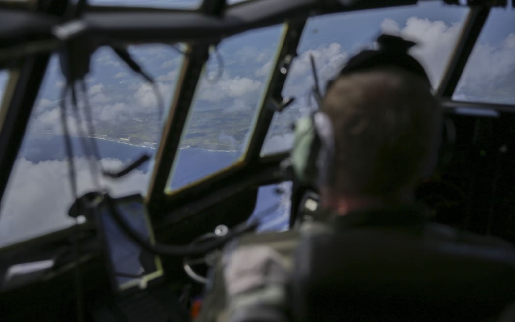 An Air Force Hercules on its way to Fua’amotu airport with supplies.