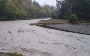 A flooded river Te Puia Springs Valley, Gisborne region, 23 March 2022