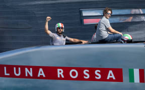 Luna Rossa Prada Pirelli crew celebrate during America's Cup challenger series off Barcelona, 2024.