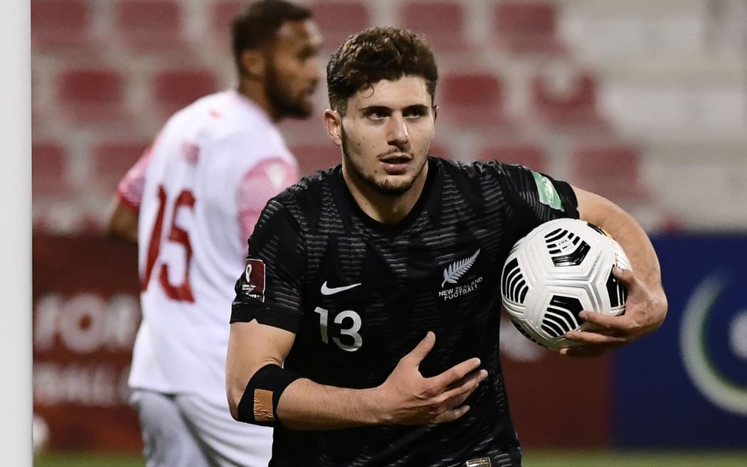 Liberato Cacace celebrates scoring for the New Zealand.