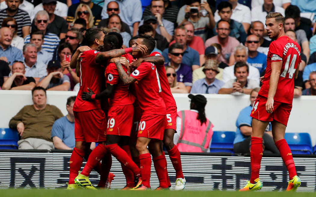 Liverpool players celebrate a goal in the EPL.