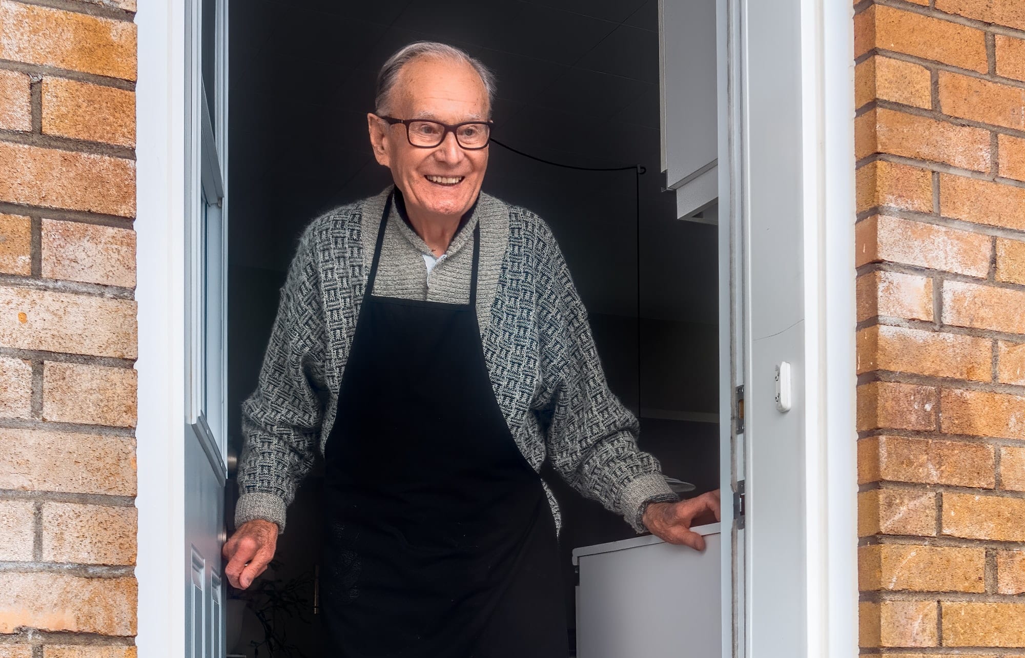 elderly man at door