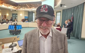 Auckland Mayor Wayne Brown wearing a Coastguard "rescue Auckland" cap at a Budget Committee meeting on 16 May, 2024.