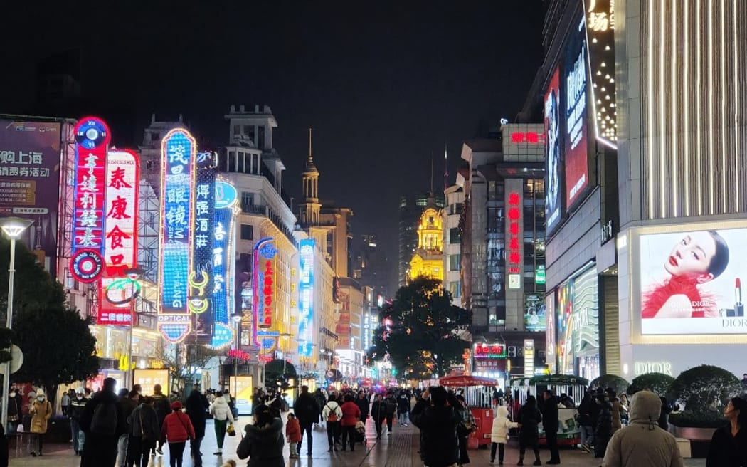 Tourists are spending money on the Nanjing Road Pedestrian Street, known as ''China's first commercial street,'' at night in Shanghai, China, on January 4, 2024. (Photo by Costfoto/NurPhoto) (Photo by CFOTO / NurPhoto / NurPhoto via AFP)