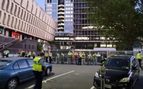 Police carrying riot shields.