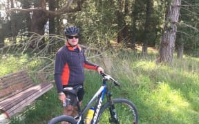 A man next to a bike.