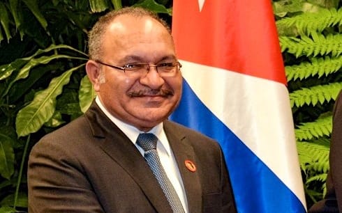 PNG Prime Minister Peter O'Neill (left) extended condolences to Cuba's President Raul Castro (right) on the death of his brother, former Cuban leader Fidel Castro.