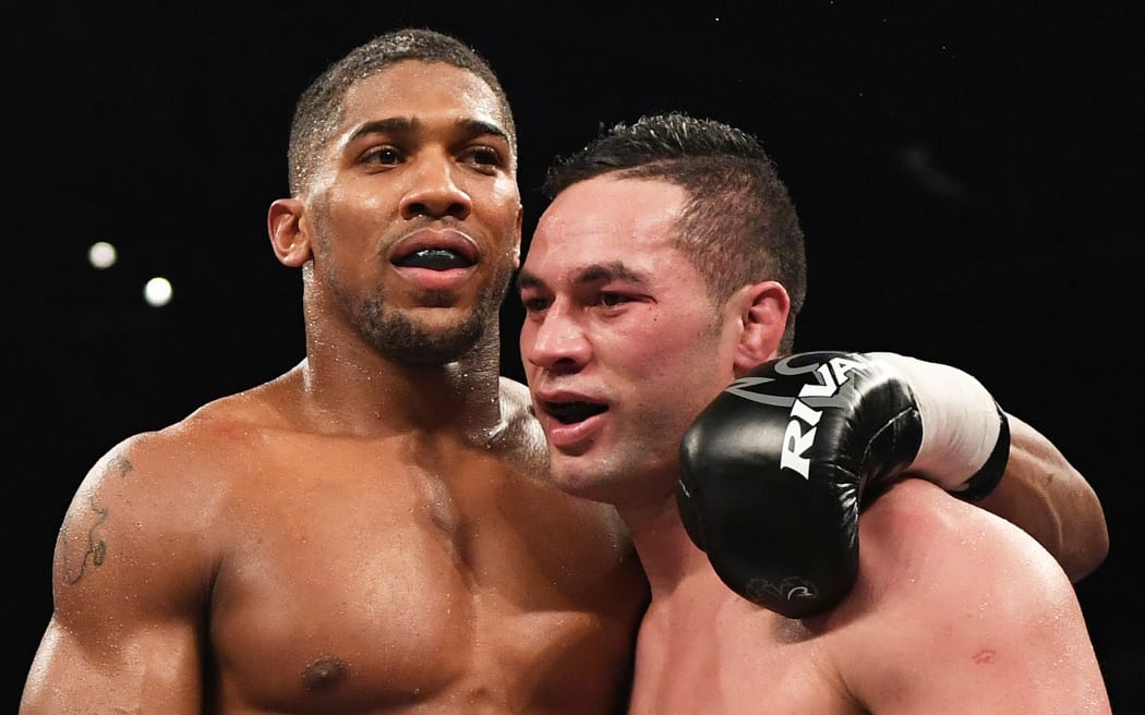 Anthony Joshua and Joseph Parker embrace after their fight in Cardiff.