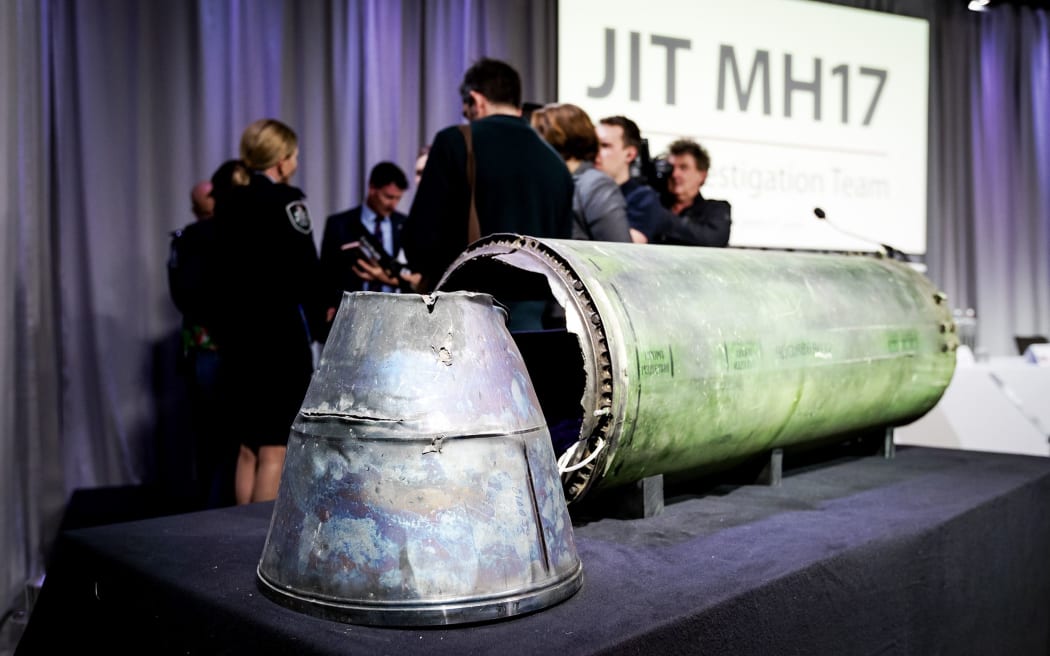 A part of the Buk Telar rocket that was fired on the MH17 flight is displayed on a table during the press conference of the Joint Investigation Team (JIT), in Bunnik on May 24, 2018.