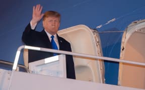 US President Donald Trump disembarks from Air Force One at Noi Bai International Airport in Hanoi on February 26, 2019, on his arrival in Vietnam for a second summit with North Korean leader Kim Jong-un.
