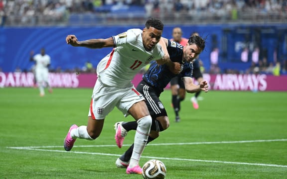 England's Morgan Rogers controls the ball against Nicolas Tagliafico of Argentina during their FIFA World Cup semifinal, at Atlanta Stadium on July 15, 2026. (Photo by Shaun Botterill/Getty Images via AFP)