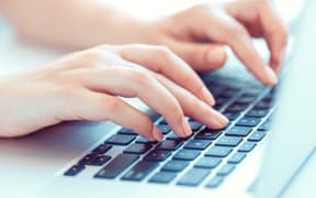 Female hands or woman office worker typing on the keyboard