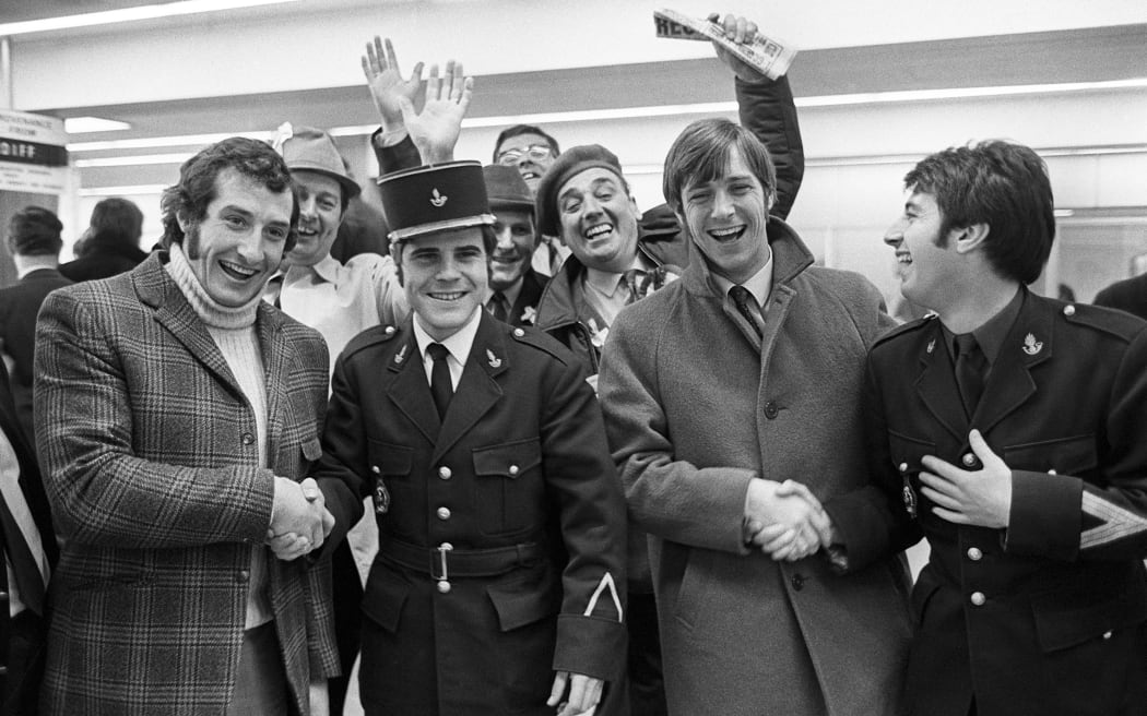 Wales Rugby Team, Gareth Edwards (left) and Barry John (2nd right) joke with French customs officers upon their arrival in France at Le Bourget airport, March 26, 1971 ahead of the Five Nations Tournament. AFP

Welsh rugby players Gareth Edwards (left) and Barry John (3rd from left) joke with French customs officiers at their arrival in France at Le Bourget Airport 26 march 1971. Wales will play against France in a Five Nations Tournament game. (Photo by AFP)
