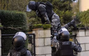 Members of the French police special force GIPN carry out searches in northern France.