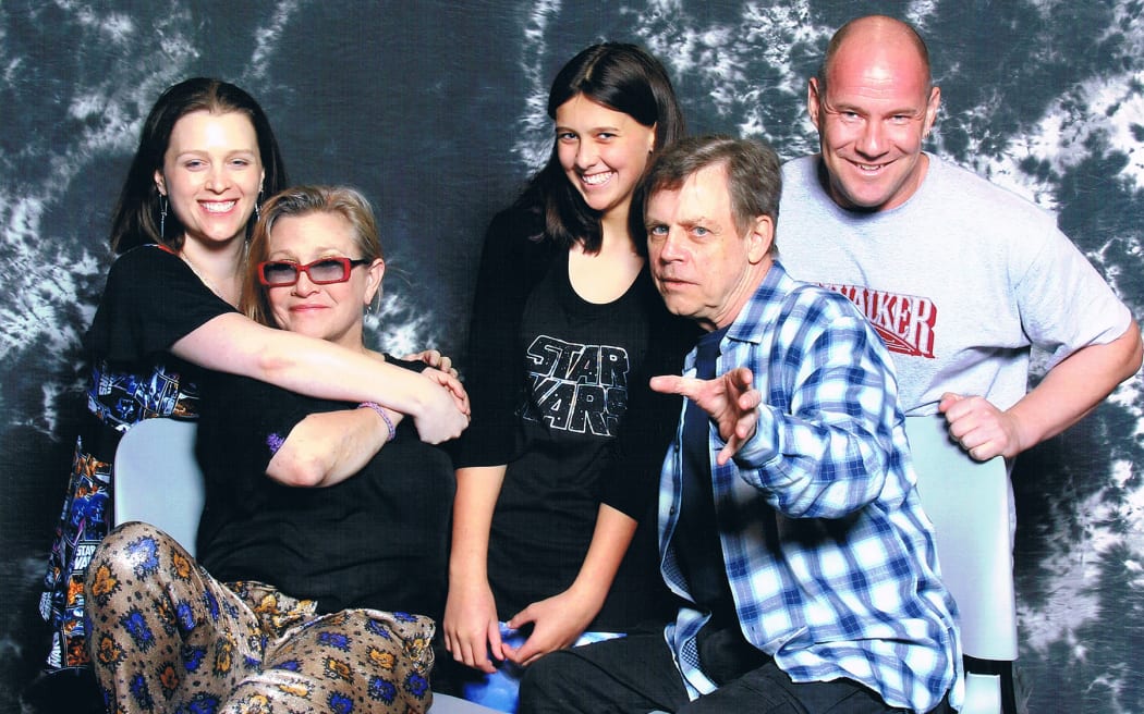Matt and Kristy Glasgow and their daughter Juliet, meeting Mark Hamill and Carrie Fisher in 2015.