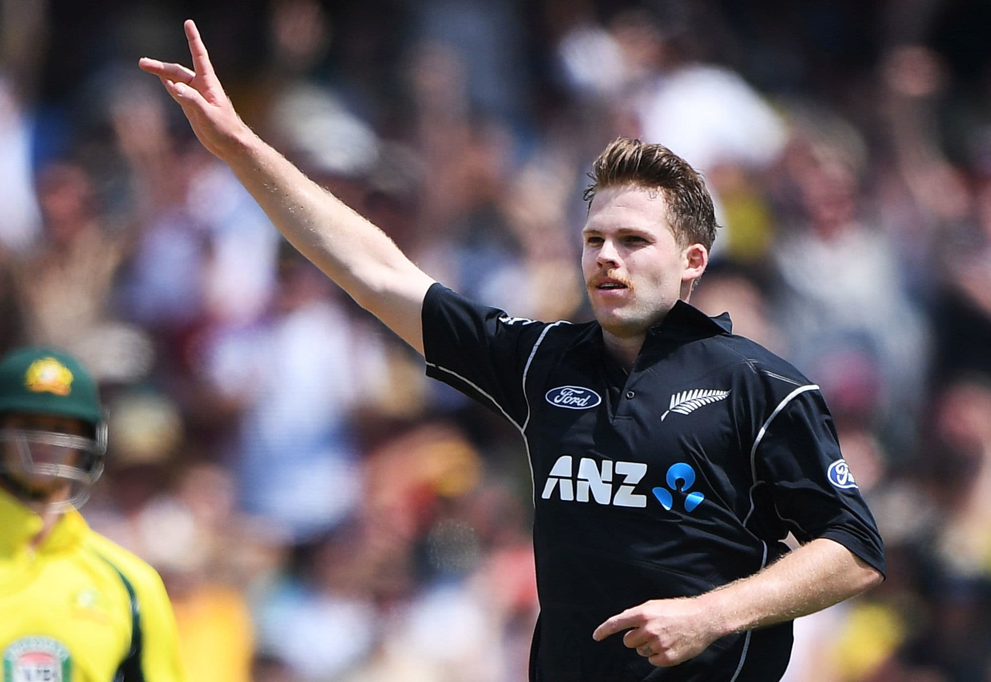 Lockie Ferguson celebrates the wicket of David Warner.