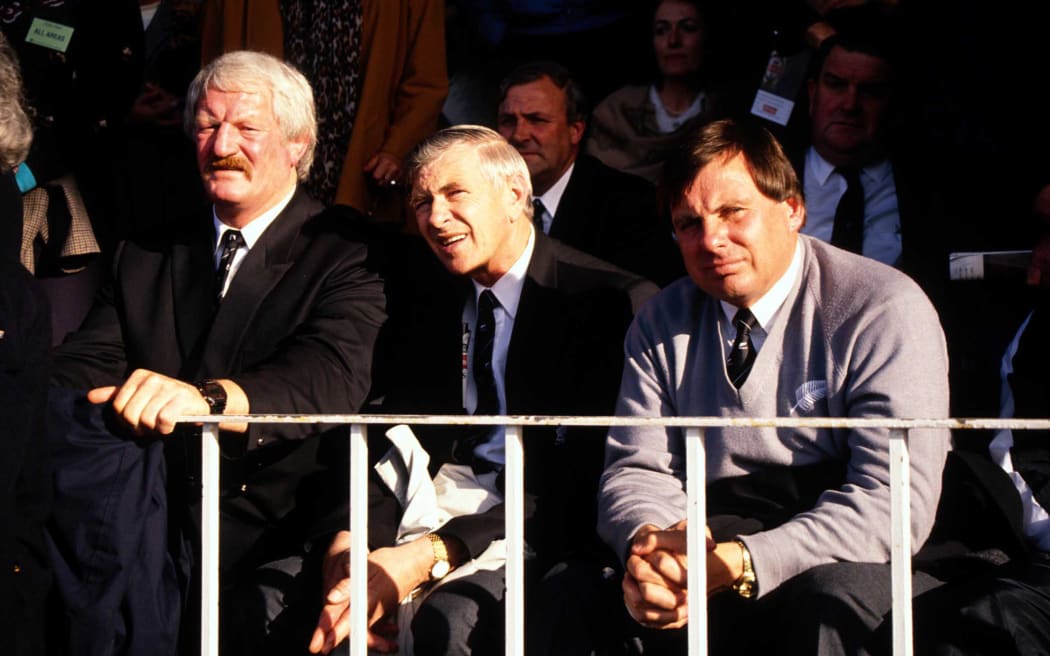 Coaches Alex Wyllie, John Sturgeon and John Hart watch on during the rugby union test between the All Blacks and Australia, 24 August, 1991. Photo: Andrew Cornaga/PHOTOSPORT