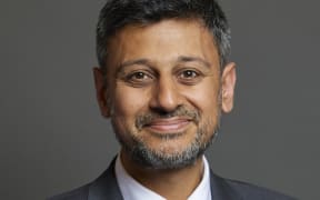 Dr Zubir Ahmed is smiling at the camera in his official UK Parliament photo.