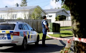 Police at the cordon of a murder investigation in Glen Eden, west Auckland on 4 November 2024.