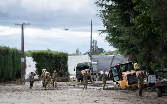 NZ Army Unimog travels through flooded roads near Puketapu, west of Napier, February 16.