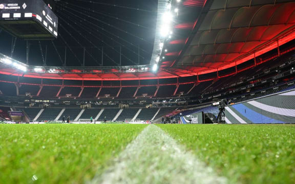 15 December 2020, Hessen, Frankfurt/Main: Football: Bundesliga, Eintracht Frankfurt - Borussia Mönchengladbach, Matchday 12 at Deutsche Bank Park. The white sideline is drawn on the edge of the pitch in the empty stadium.