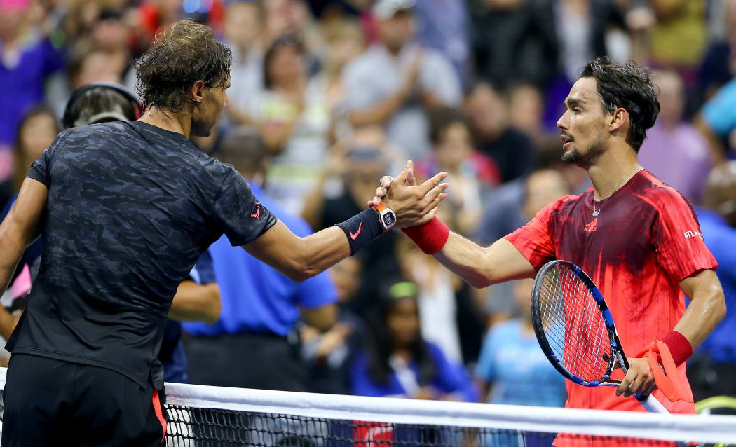 NEW YORK SEPTEMBER 04: Rafael Nadal of Spain congratulates Fabio Fognini of Italy at the USTA Billie Jean King National Tennis Center. Elsa/Getty Images/AFP