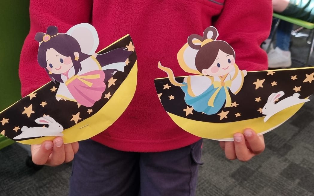 Izzy Zhang and her colleague run craft workshops at Auckland's Highland Park Library in celebration of the Mid-Autumn Festival.