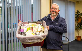MDC solid waste manager Alec McNeil with his crate liner prototype