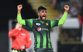 Pakistan's Mohammad Amir celebrates during the second T20 match against the Black Caps after claiming the wicket of Colin Munro.