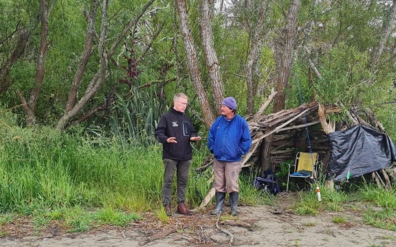 Richie Cosgrove chats with an angler near the Waimakariri River mouth.