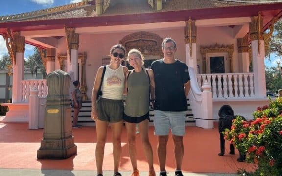 Sophie Rottenberg, Laura Reiley and Jon Rottenberg outside a Buddhist temple in Tampa, Florida, 2023.