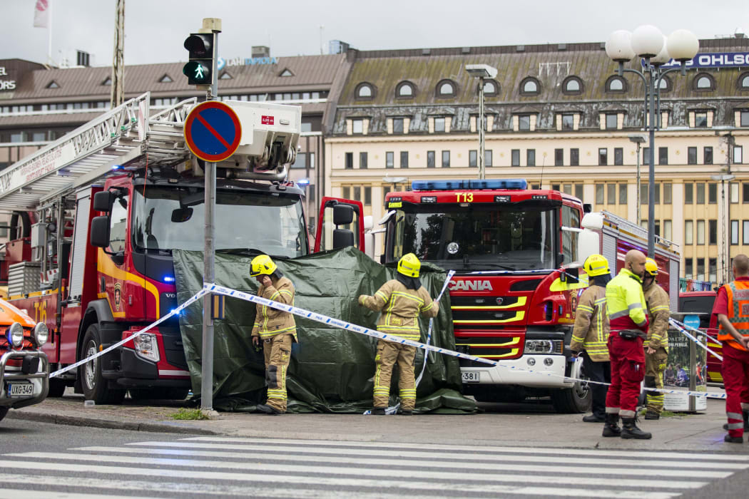 Rescue personnel cordoned off the area at the Turku Market Square where several people were stabbed.