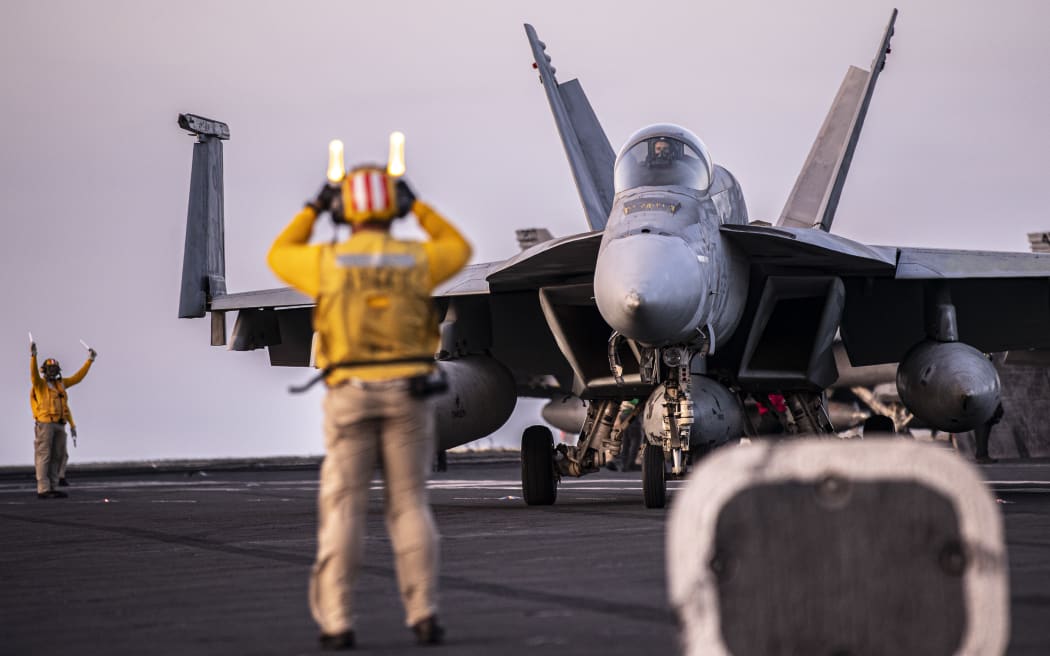 An F/A-18E Super Hornet, attached to Strike Fighter Squadron (VFA) 195, taxis on the flight deck of Nimitz-class aircraft carrier USS George Washington (CVN 73) while underway in the Timor Sea, July 16, 2025, in support of Talisman Sabre. Talisman Sabre is the largest bilateral military exercise between Australia and the United States advancing a free and open Indo-Pacific by strengthening relationships and interoperability among key allies and partners, while enhancing our collective capabilities to respond to a wide array of potential security concerns.