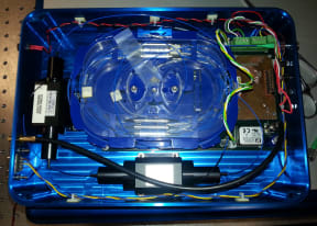 A photo of the inside a pulsed fibre laser showing the optical fibres in coils