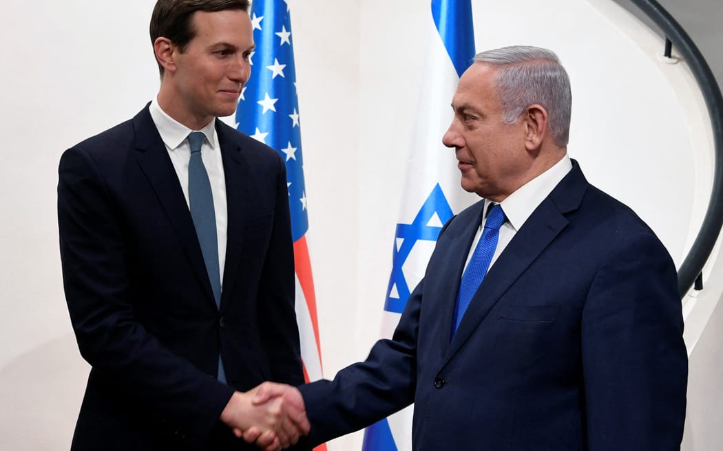 This handout picture provided by the US Embassy in Jerusalem, shows Israeli Prime Minister Banjamin Netanyahu (R) shaking hands with the US president's son-in-law and adviser Jared Kushner in the holy city on May 30, 2019. Kushner met the Israeli prime minister today as part of a Middle East tour before Washington unveils its long-awaited plan for Israel-Palestinian peace. (Photo by Matty Stern / U.S. Embassy Israel / AFP) / XGTY / RESTRICTED TO EDITORIAL USE - MANDATORY CREDIT "AFP PHOTO / MATTY STERN/U.S. EMBASSY JERUSALEM" - NO MARKETING - NO ADVERTISING CAMPAIGNS - DISTRIBUTED AS A SERVICE TO CLIENTS