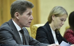 This photo taken on December 12, 2023 shows Oleg Kozhemyako (L), Governor of the Maritime Territory Administration of Russia, holding talks with Yun Jong Ho (not pictured), North Korea's Minister of External Economic Relations at the Mansudae Assembly Hall in Pyongyang. (Photo by KIM Won Jin / AFP)