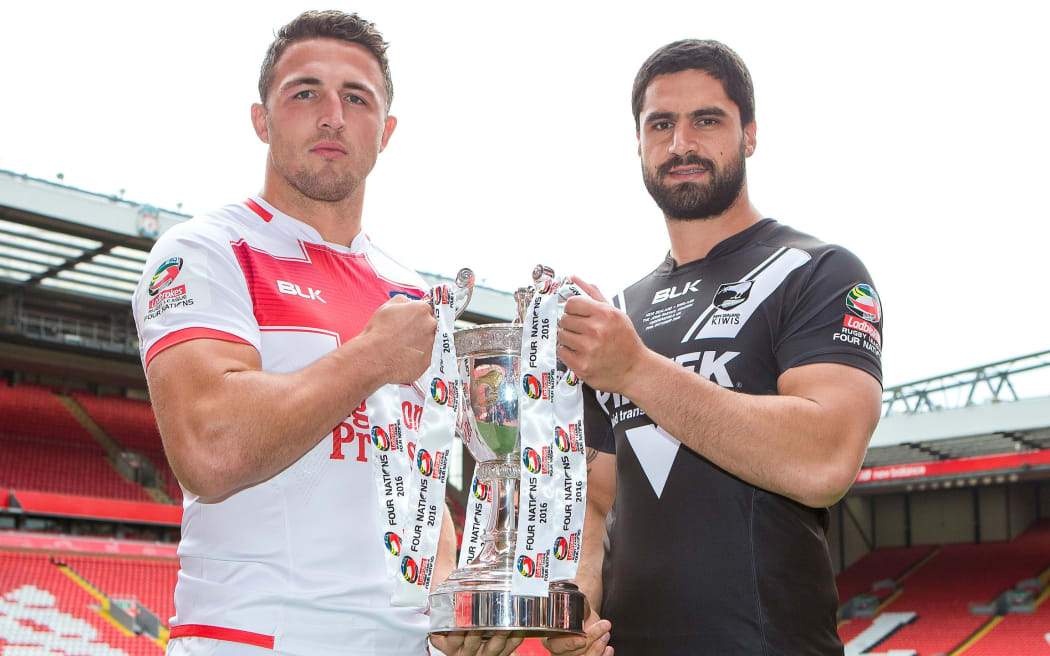 Sam Burgess and Jesse Bromwich hold the Four Nations trophy.