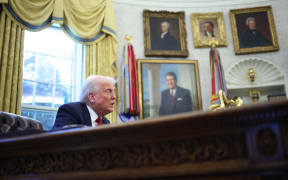 US President Donald Trump speaks to the press after signing an executive order in the Oval Office of the White House on March 26, 2025 in Washington, DC. President Trump announced 25% tariffs on all foreign-made cars.