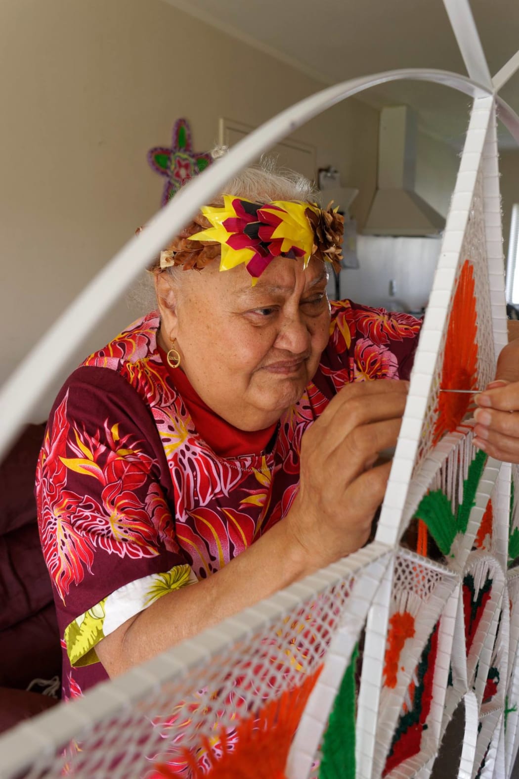 Lakiloko working on one of her art works.