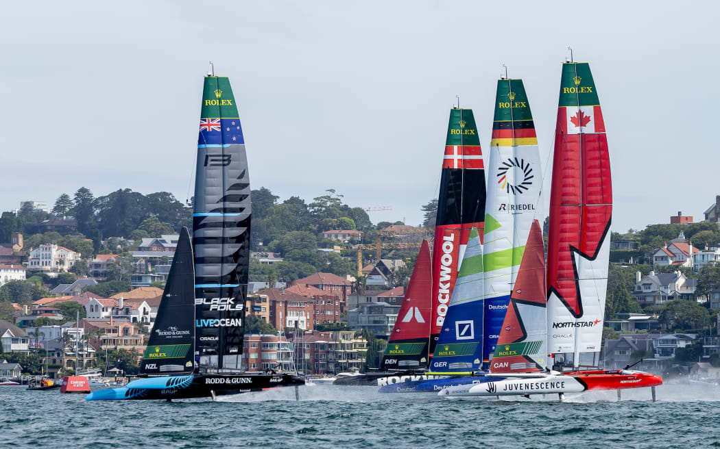 New Zealand SailGP Team helmed by Peter Burling, ROCKWOOL Denmark SailGP Team helmed by Nicolai Sehested, Germany SailGP Team presented by Deutsche Bank helmed by Erik Heil and Canada NorthStar SailGP Team helmed by Giles Scott on Race Day 2 of the KPMG Australia Sail Grand Prix in Sydney, Australia. Sunday 9 February 2025. Rolex SailGP Championship Event 3 Season 2025. Photo: Felix Diemer for SailGP. Handout image supplied by SailGP