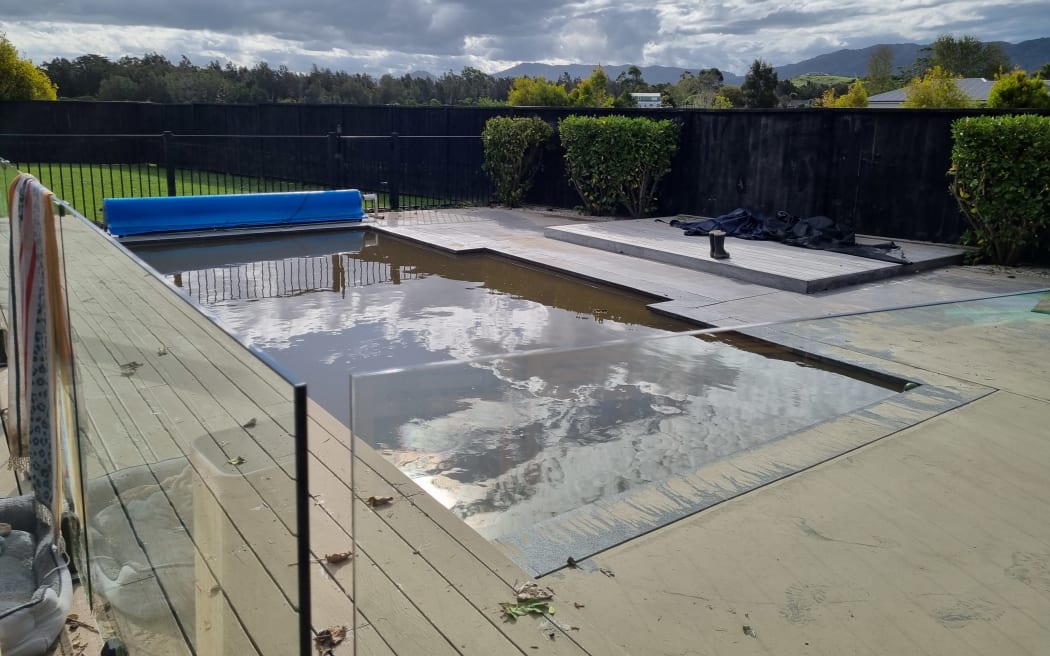 Damien Hochberg's back yard and pool post-flood.