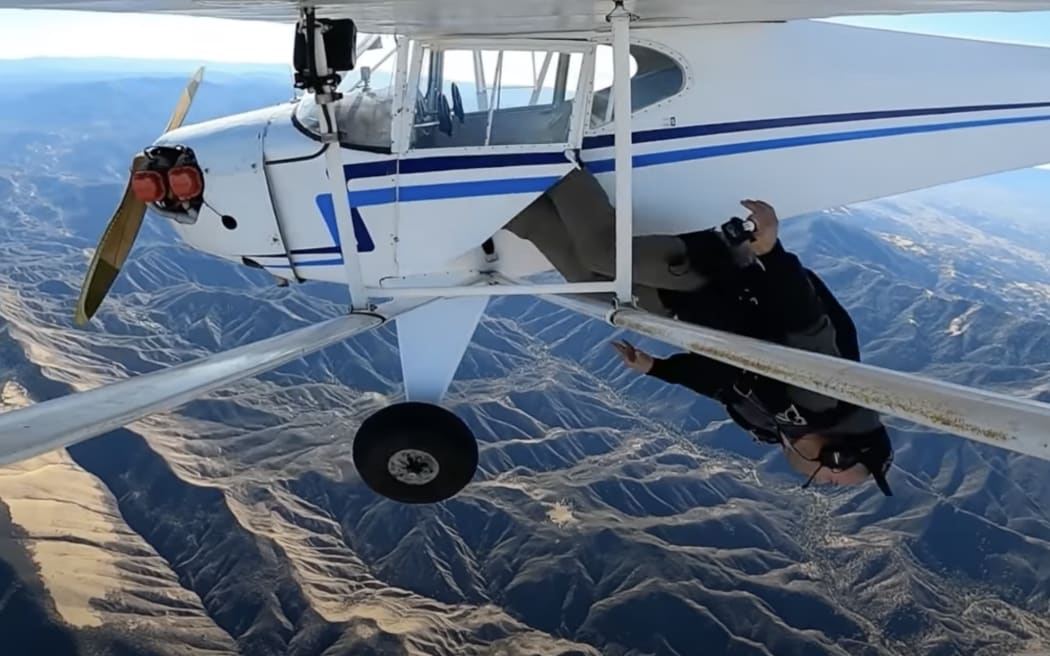 Jacob ejecting from the plane before the crash.