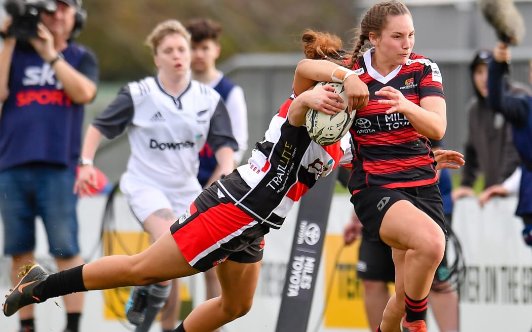 Bronwyn Dibb of Canterbury is tackled by Shonte To'a of Counties Manukau.