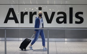 Travellers arrive at Heathrow's Terminal 5 in west London on 2 August, 2021 as quarantine restrictions ease.