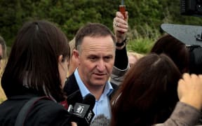 Prime Minister John Key talking to media in the Manawatu Gorge.